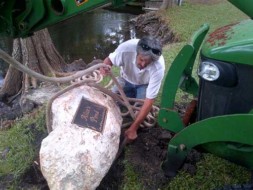 Prepared site and positioned dedication monument